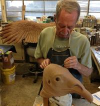 Exhibits staff sculpting vulture head